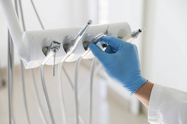 Professional Tooth Extraction technician working in Orange County County, TX